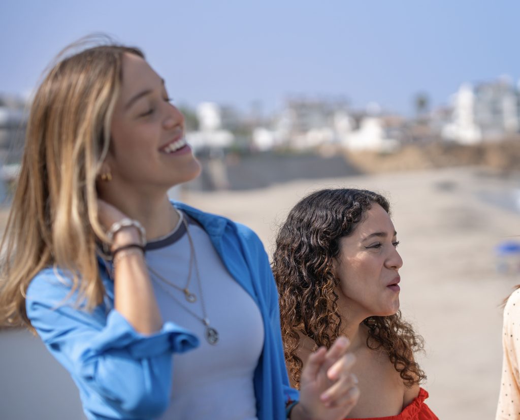 Friends being social at the beach